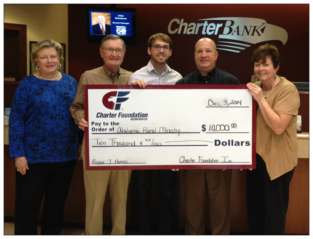 Joe Davis, Director of Ministry Operations, and Paul Grisham, Chair of the Development Committee, accept a $10,000 grant from the Charter Foundation of Charter Bank.